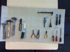 Tools for taking apart. To make sure all tools are returned, I outlined and labeled them. Saw this on a wall at Chimera Makerspace.